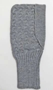 a pair of gray knitted mittens sitting on top of a white tablecloth