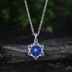 The necklace is handmade,very high quality! It can be made in white gold,rose gold or yellow gold with 14k or 18k. However for some people who are nickel allergic,I can also make it to 925 sterling silver to make you can wear it. Details: *7mm round lab blue star sapphire. *Side stone: sapphires. Chain: 16+2 Inches length. Returns & Warranty 30-Day money back guarantee (starting from the day of delivery). "Made to Order" purchases qualify for our 30-day money back guarantee. The 30-day money bac Star Sapphire Necklace, Blue Star Sapphire, Star Sapphire, Sapphire Pendant, September Birthstone, Sapphire Necklace, Black Swan, Necklace Vintage, Blue Star