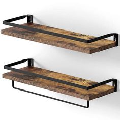 two black metal and wood shelves on the wall