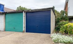 two garages side by side with blue doors