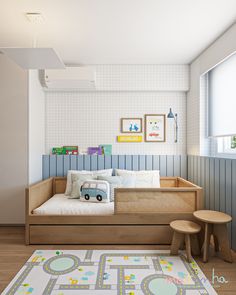 a child's room with a bed, table and stools