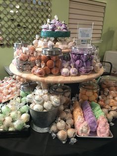 a table topped with lots of different types of candies and other sweets on top of it