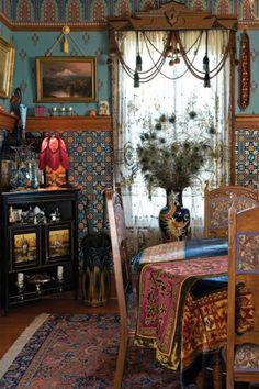 an ornately decorated dining room with peacock wallpaper