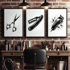 three black and white pictures hanging on a brick wall next to a desk with scissors