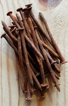 a pile of sticks sitting on top of a wooden table