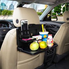 the back seat of a car is filled with food and drinks