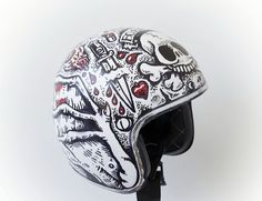 the helmet is decorated with skulls and other things