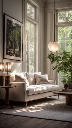 a living room filled with lots of furniture next to large windows and potted plants