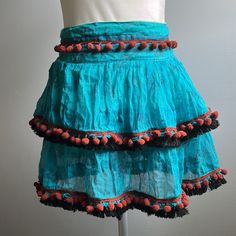 Tiered Lined Mini Skirt In Cotton And Viscose With Elastic Waist, Fringed Hem, And Decorative Pom Poms Floral Print Made In Indonesia Poupette St Barth, St Barth, Pom Poms, Black Blue, Print Making, Mini Skirt, Blue Black, Elastic Waist, Pom Pom