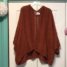 Never Worn Sonoma Cardigan/Poncho Crocheted/Knitted Pattern Beautiful Rust Color Flowy Sleeves One Size Just Wasn’t My Style Almost Perfect Condition With No Major Flaws One Size Pointelle Knit Sweater For Fall, Oversized Brown Poncho For Spring, Casual Brown Poncho For Spring, Fall Open Knit Sweater With Batwing Sleeve, Fall Open Knit Batwing Sleeve Sweater, Open Knit Batwing Sleeve Sweater For Fall, Casual Open Knit Poncho One Size, Fall Batwing Sleeve Open Knit Sweater, One Size Open Front Open Knit Outerwear