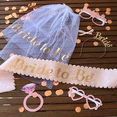 bride to be party decorations on a table with confetti and glasses for decoration