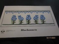 the bluebonnets cross stitch pattern is on display