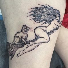 a woman with a cat on her thigh