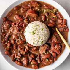 a white bowl filled with beans and rice