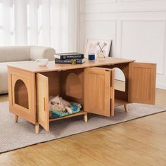 a dog is laying in his bed under the table