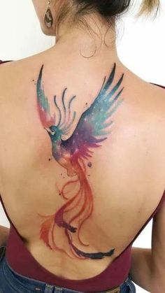 a woman with a colorful bird tattoo on her back