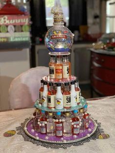 a multi - tiered bottle display on a table