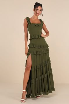 Pop the bubbly and make a toast to looking lovely in the Lulus Compelling Romantic Olive Green Ruffled Tiered Maxi Dress! Lightweight woven chiffon shapes tank straps that support a bodice with a square neckline, ruffled trim, and flattering seaming. Fitted waist tops a tiered, flaring skirt with ruffled bands that ends at a maxi hem with a flirty side slit. Hidden zipper/clasp at side. Fit: This garment fits true to size. Length: Floor length. Size medium measures 60.5" from shoulder to hem. Bust: Great for any cup size. Waist: Fitted - very fitted at natural waist. Hip: Loosely Fitted. Undergarments: May be worn with a strapless bra, adhesive bra, petals, or no bra. Fabric: Fabric has no stretch. Lined. Shell: 100% Polyester. Lining: 100% Polyester. Hand Wash Cold. Do Not Bleach. Line Dr Wedding Guest Dress Black Tie, Black Tie Wedding Guest Dresses, Green Wedding Guest Dresses, Affordable Formal Dresses, Black Tie Wedding Guest, Olive Green Bridesmaid Dresses, Black Tie Wedding Guest Dress, Pop The Bubbly, Dress Stores