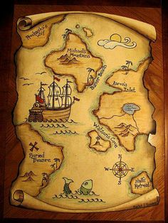 a wooden map with an image of a pirate ship on it