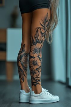 a woman's legs with flowers on them