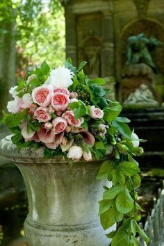 a large vase filled with lots of pink and white flowers