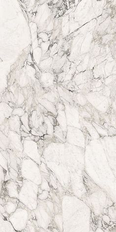 a white marble textured surface with black and gray accents