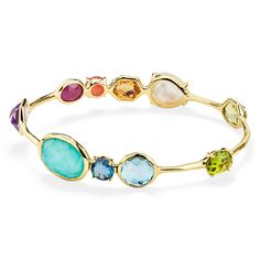 Color is the defining feature of this 18K gold bangle, each stone is deeply hued and hand-faceted to intensify its richness. The prong and bezel-set gems adorning its surface include dark amethyst, rock crystal, mother-of-pearl, lapis, peridot, Swiss blue topaz, and a triplet of mother-of-pearl layered above and below amethyst. Wear it to enhance the vibrancy of any bracelet stack. • 18K Gold • Gemstones: Dark Amethyst, Rock Crystal, Mother-of-Pearl, Lapis, Peridot, Swiss Blue Topaz, Clear Quart Gems Stones Jewelry, Ippolita Jewelry, Amethyst Rock, 18k Gold Bangle, Dark Amethyst, Rainbow Gemstones, Bangles Jewelry Designs, Rock Candy, Gold Bangle