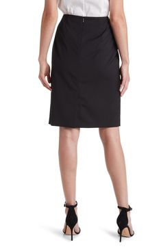 Bring modern style to your work-to-weekend wardrobe with this pencil skirt crafted from pure virgin wool. 23" center front length (size 8)   Lined   100% virgin wool   Dry clean   Imported   Hugo Boss/BOSS/HUGO has received the Fair Labor Association accreditation, which signifies that the company has effective systems and procedures in place to successfully uphold fair labor standards throughout its supply chains, including strategies and tools to address and improve working conditions Chic Business Knee-length Pencil Skirt, Chic Knee-length Pencil Skirt For Business, Tailored Pencil Skirt For Workwear, Tailored Knee-length Skirt For Work, Tailored Pencil Skirt For Office, Tailored Skirt For Office, Formal Wool Pencil Skirt Knee-length, Wool Lined Skirt For Workwear, Elegant Knee-length Bottoms For Business