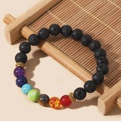 Elevate your senses with our beautiful Chakra Lava Rock Bracelet Diffuser. This essential oil diffuser bracelet combines the energy protection of lava stones with the soothing benefits of aromatherapy, creating a practical and spiritual bracelet. Our Lava Rock Bracelet features seven mixed chakra stones, each one chosen to align and balance your chakra system. The 7 stones help to clear energy blockages and promote the free flow of energy. One of the unique features of this Chakra essential oil Chakra Bracelet Meaning, 7 Chakras Bracelet, 7 Chakra Bracelet, Clear Energy, Spiritual Bracelets, Energy Protection, Lava Rock Bracelet, Essential Oil Bracelet, Aromatherapy Bracelet