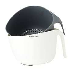 a white and black strainer with two colanders in it's bottom