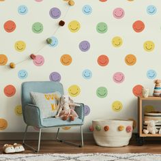 a child's room with colorful polka dot wallpaper and a blue chair in the foreground