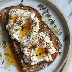 two pieces of toast topped with whipped cream and sprinkles on a plate