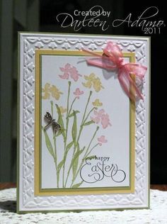 a card with flowers and a butterfly on it