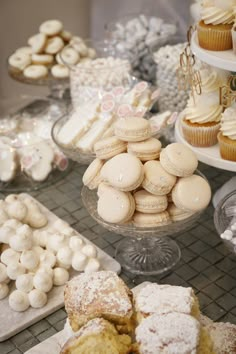 a table topped with lots of different types of desserts