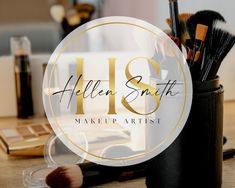 makeup brushes in a cup on a table with the words helen smith make - up artist