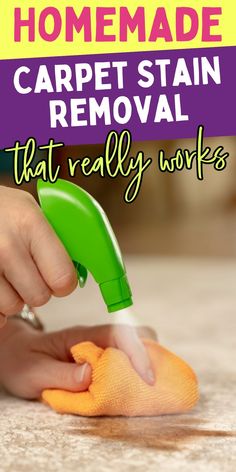 someone is cleaning the floor with a sponge and a green hand held by a rag