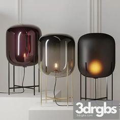 three different colored lamps sitting next to each other