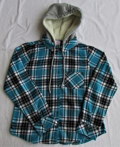 "Description:  Up for sale is a No Boundaries girls cotton flannel shirt with sherpa hood. The size is medium (7-9). This shirt is made of 100% cotton fabric. The shirt has a multicolored plaid pattern in turquoise, black & white. This shirt has a full button front, cuffs with 1 breast pocket, roll-tab sleeves, and a gray sherpa-lined hood.   Please check the measurements before ordering.  Chest  (armpit to armpit) 19.50\" Sleeve Length (shoulder seam - bottom of cuff)  23.50\" Back Length (neck seam - bottom of shirt) 24.50\" Shipping:  Merchandise will ship within 24 hrs. of receipt of confirmed payment. We ship via USPS 1st. Class Mail with delivery confirmation. Shipping rates quoted are for the US only. International rates are higher." Fleece Lined Flannel Shirt, Kids Fleece, Sherpa Lined, Cotton Flannel, Flannel Shirt, Plaid Pattern, Women's Plaid Shirt, Clothing Items