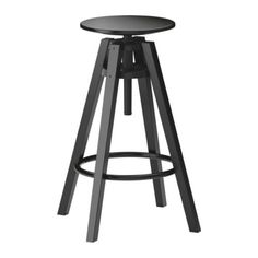 a black stool with an adjustable seat and foot rest on the bottom, in front of a white background