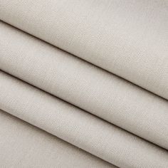 three pieces of beige fabric on top of each other