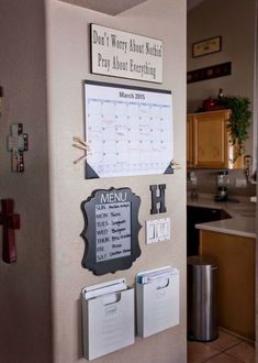 a refrigerator with magnets on it and a calendar attached to the side of it