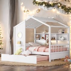 a white doll house bed in a room with christmas lights