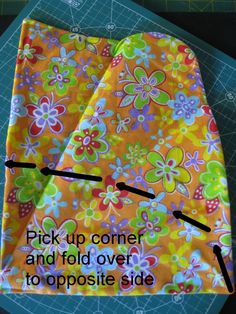 two pieces of fabric with the words pick up corner and fold over to opposite side