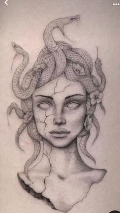 a woman's face with a snake on her head