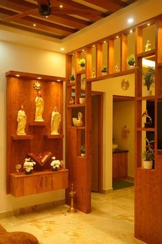 a living room filled with wooden shelves covered in figurines and flowers on top of them