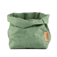 a green bag with a tag on it