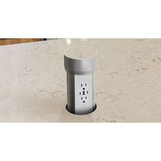 an electrical outlet on a marble counter top