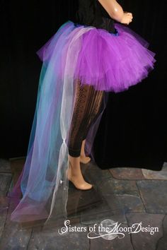 a woman wearing a purple and blue tutu skirt