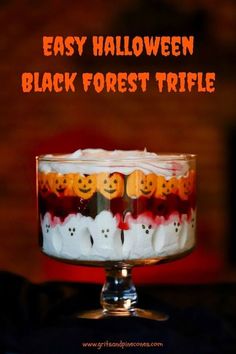 an easy halloween black forest trifle with marshmallows and candy in it