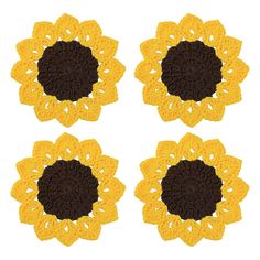 four crocheted sunflowers are shown in yellow and brown